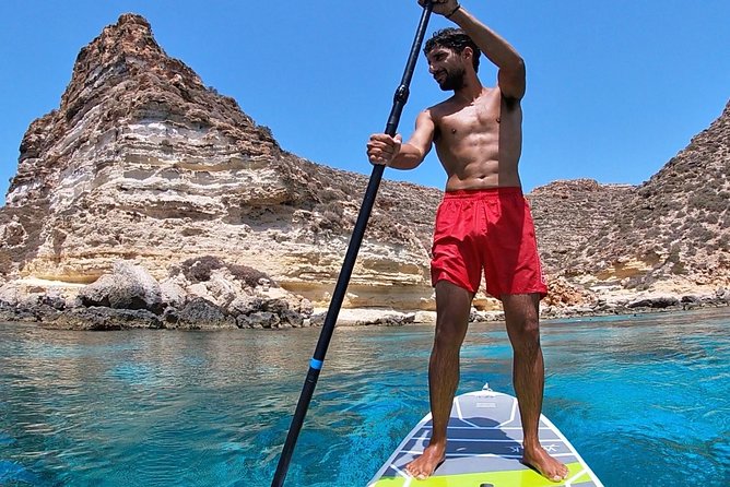 7 hours Boat trip to Lampedusa lunch, SUP and Snorkeling - Returning to port and the migration monument moment