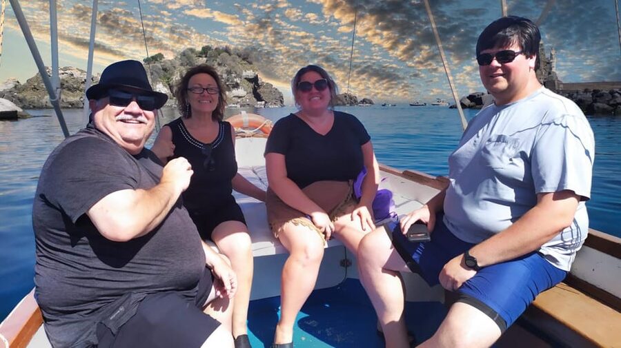 Aci Trezza boat tour sunset and dinner sicilian family home - A stop for the Ulysses Caves in Ognina, plus the chance to swim