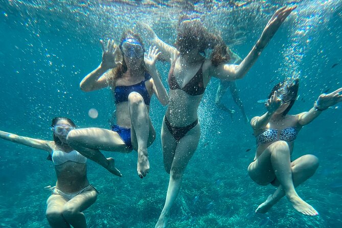 Boat tour to Egadi Favignana and Levanzo islands from Trapani - Stop 1: Scogliera Cala Azzurra for a First Swim in Clear Bay Water