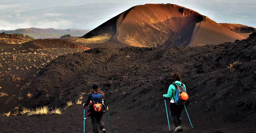 Catania: Etna Morning or Sunset Trek with Lava Tunnel & Gear - Walking the volcanic “lunar” terrain: craters, lava deserts, and secondary features