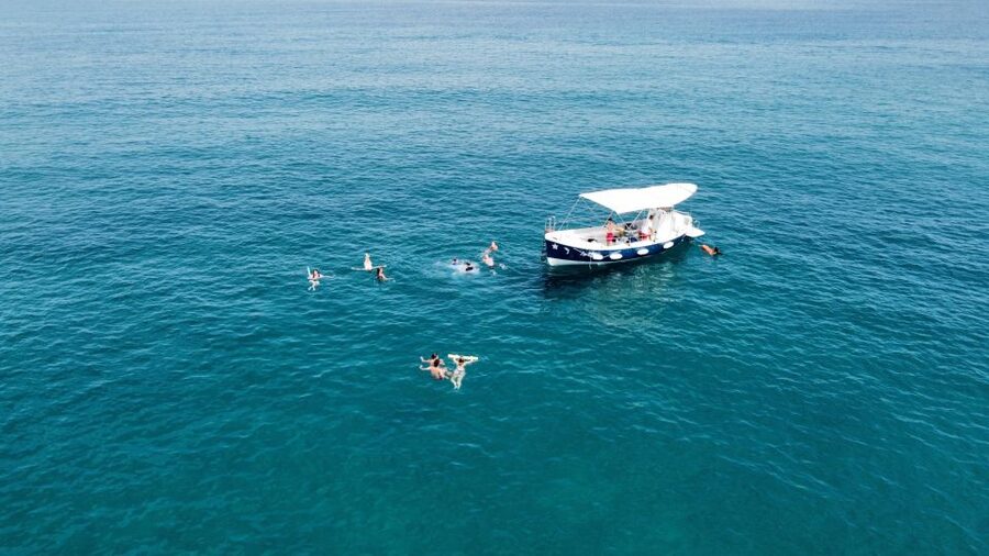 Cefalù: Guided Boat Excursion along the coast of Cafalù - The On-Board Aperitif: Prosecco and Salty Snacks at Sea Level