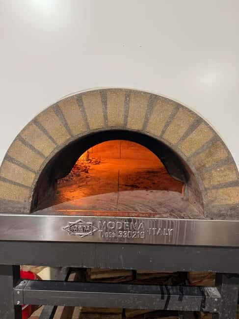 Palermo: Pizza & Tiramisu Class with Free Flowing Fine Wine - Entering a real Palermo pizzeria, not a demo kitchen