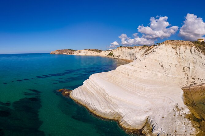 Scala dei Turchi in 3.5 hours, boat tour with stops for swimming - The panorama stretch: bay of the sirens, groves, and temple views from offshore