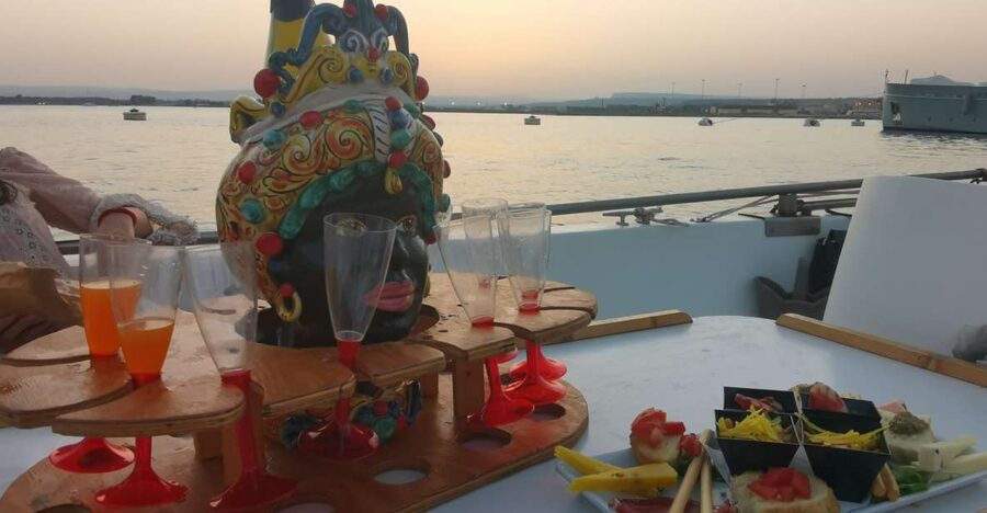 Syracuse: Ortigia Sunset Cruise with Aperitif - The First Leg Out: Capuchin Cove, Capuchin Cave, and Dolphin Rock