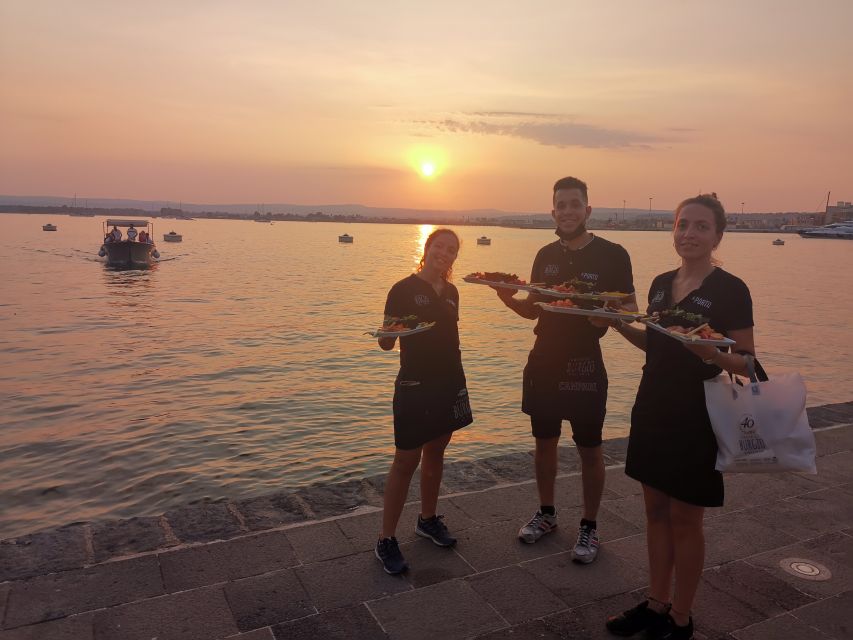 Syracuse: Ortigia Sunset Cruise with Aperitif - The Sunset Arrival, Music Onboard, and Umbertino Bridge Ending