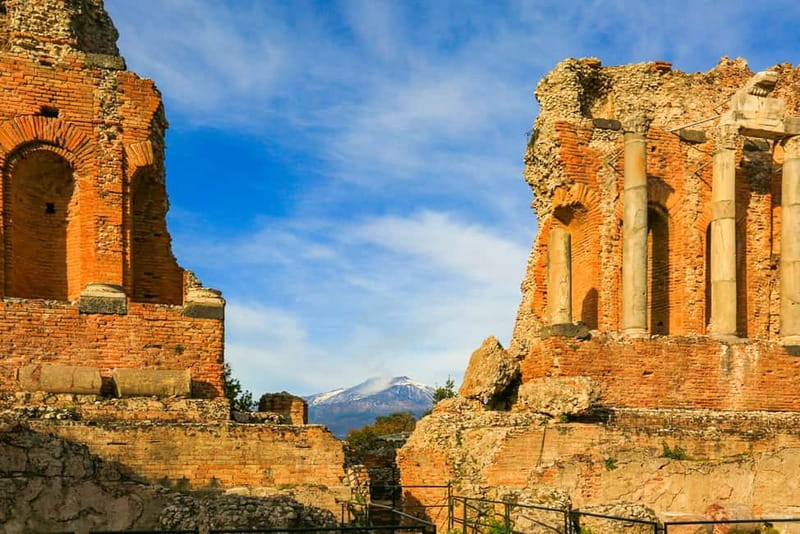 The Greek theatre at Taormina with Mount Etna behind it